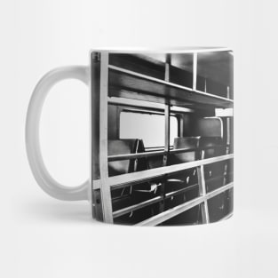 inside an empty train car Mug